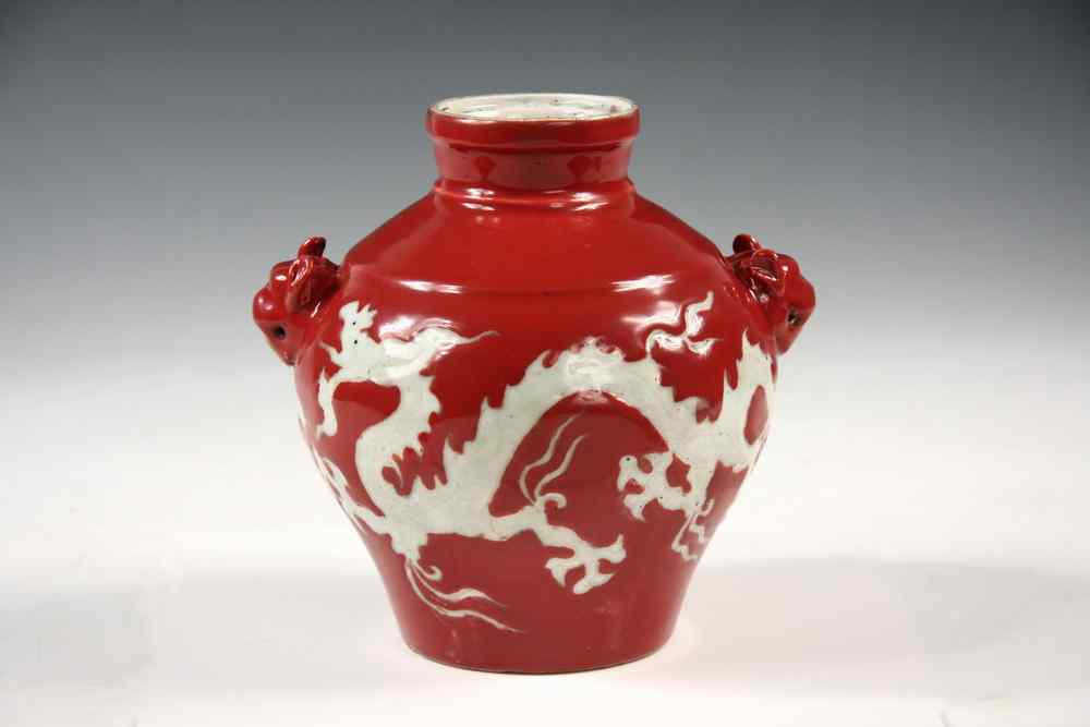 Appraisal: VASE - Red glazed dragon motif two handle vase with