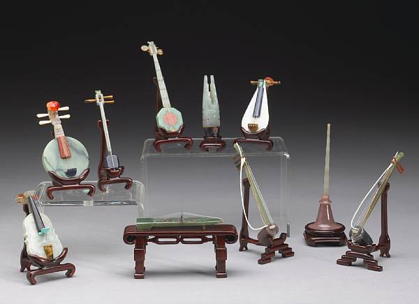 Appraisal: A set of ten pieced stone miniature musical instruments The