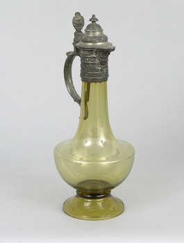 Appraisal: A Yellow Glass Ewer with Pewter Mounts A gracefully blown