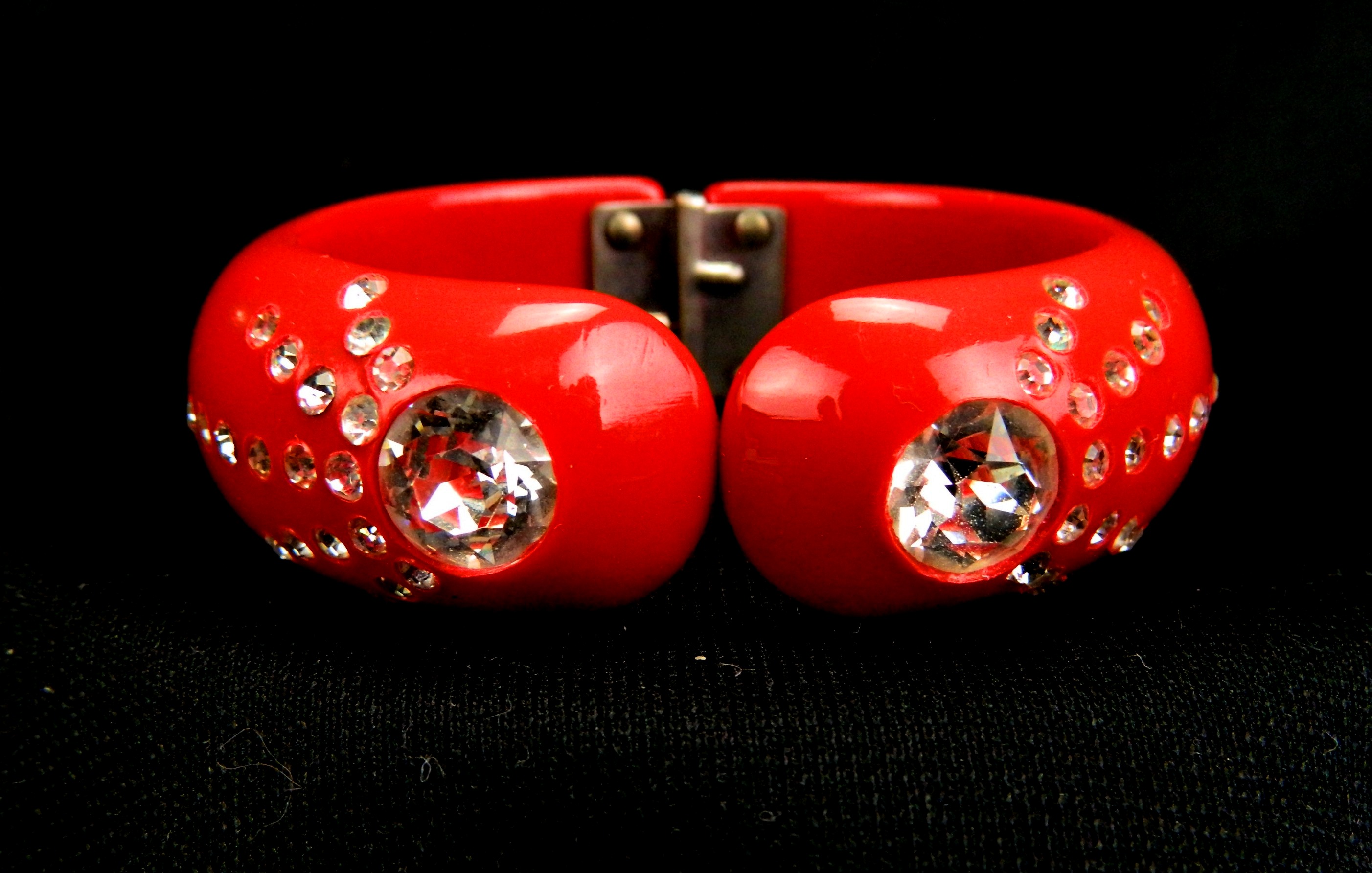 Appraisal: Weiss style red hinged bracelet with clear inset rhinestones Exterior