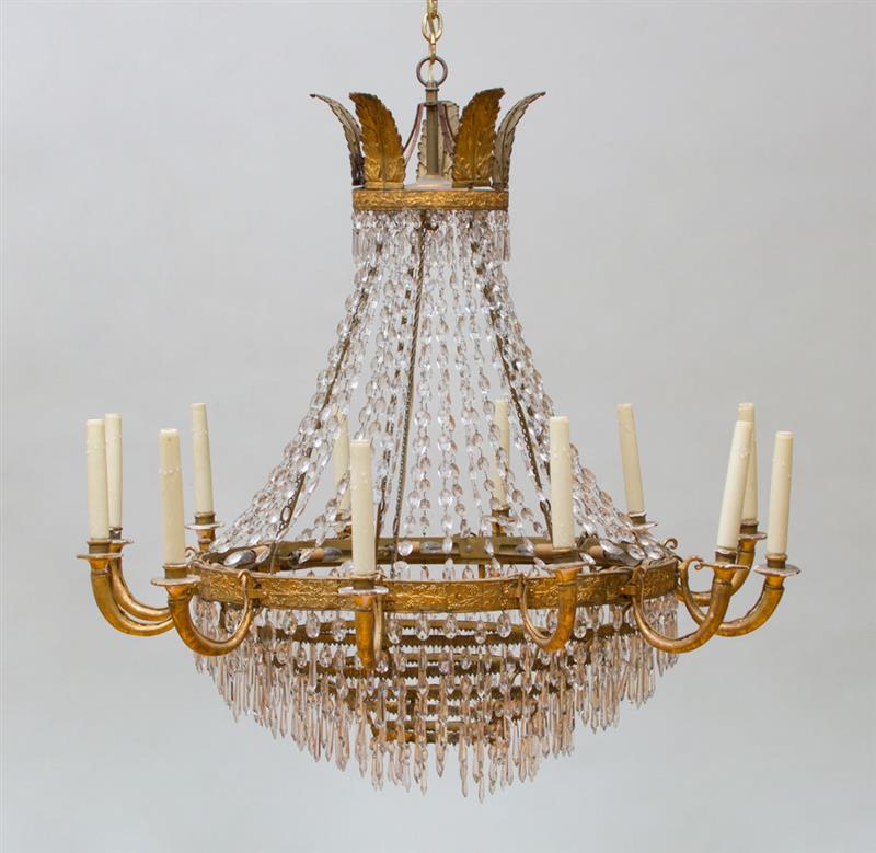 Appraisal: ITALIAN GILT-T LE AND GLASS TWELVE-LIGHT CHANDELIER Fitted for electricity