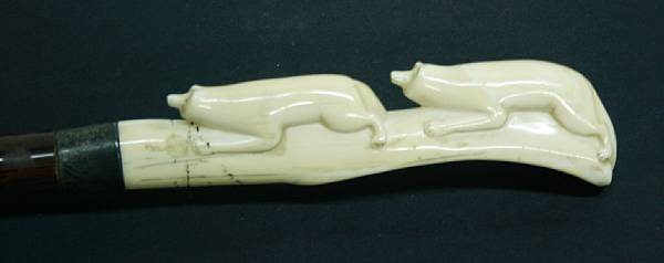 Appraisal: A walking stick with carved Eskimo ivory handle Depicting two