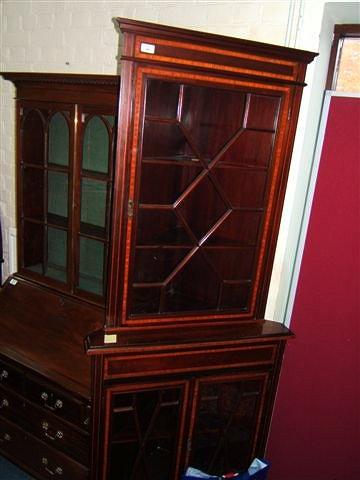 Appraisal: An Edwardian mahogany and satinwood banded corner cabinet wide