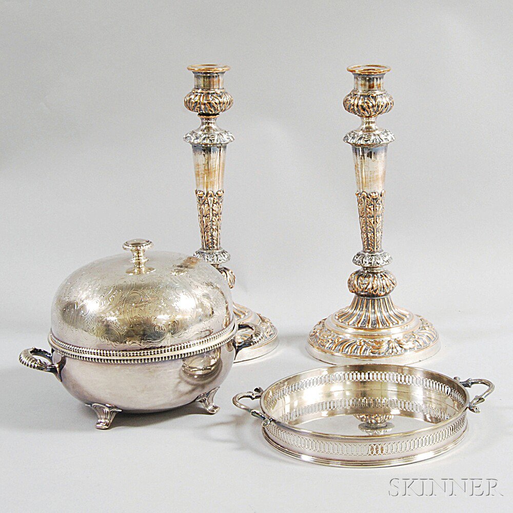 Appraisal: Four Pieces of Silver-plated Tableware a pair of candlesticks a