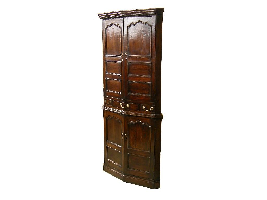 Appraisal: th century Welsh stained oak freestanding corner cupboard the moulded