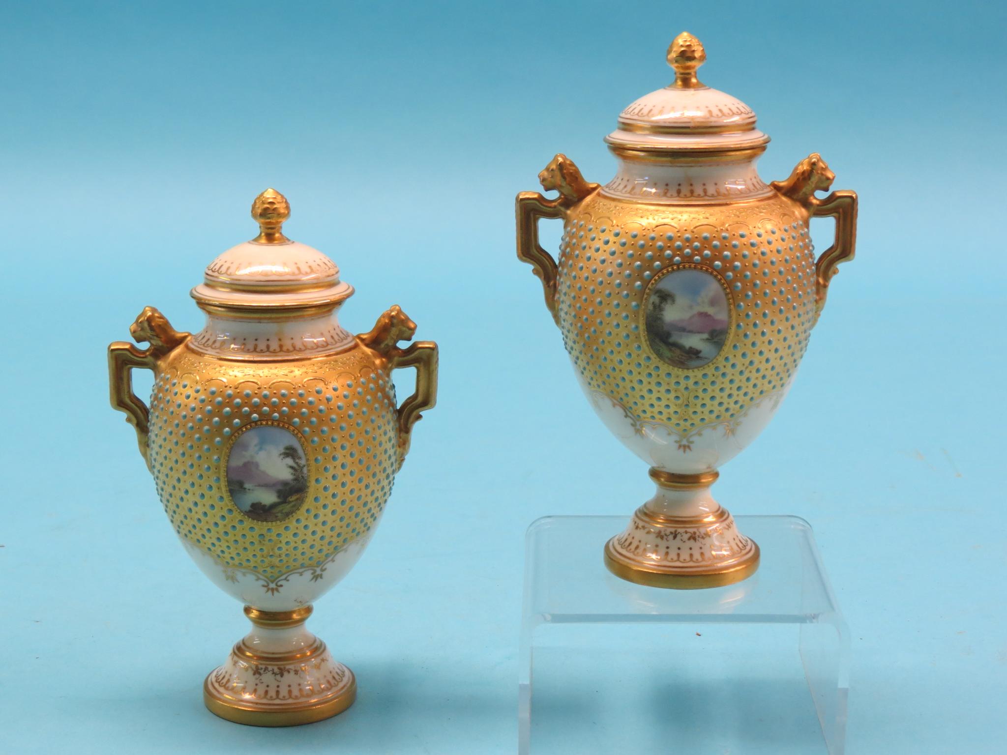 Appraisal: A pair of Coalport bone china vases with covers twin-handled