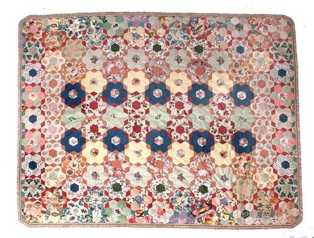 Appraisal: A TH CENTURY PATCHWORK QUILT with all over polychrome bird