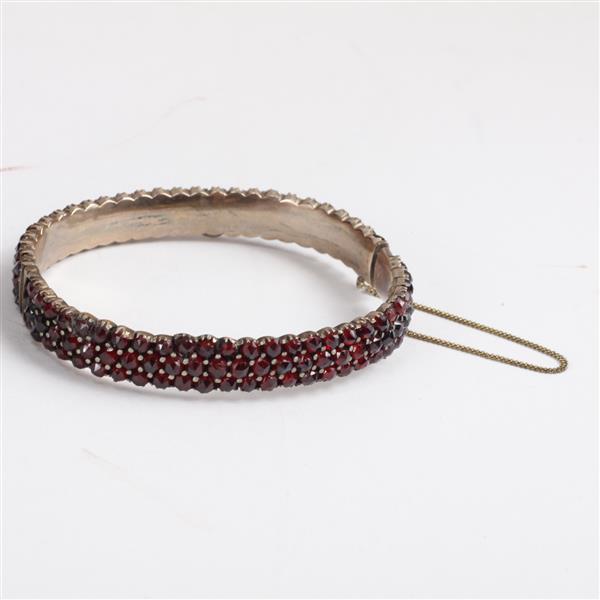 Appraisal: Victorian row garnet hinged bangle bracelet inner width