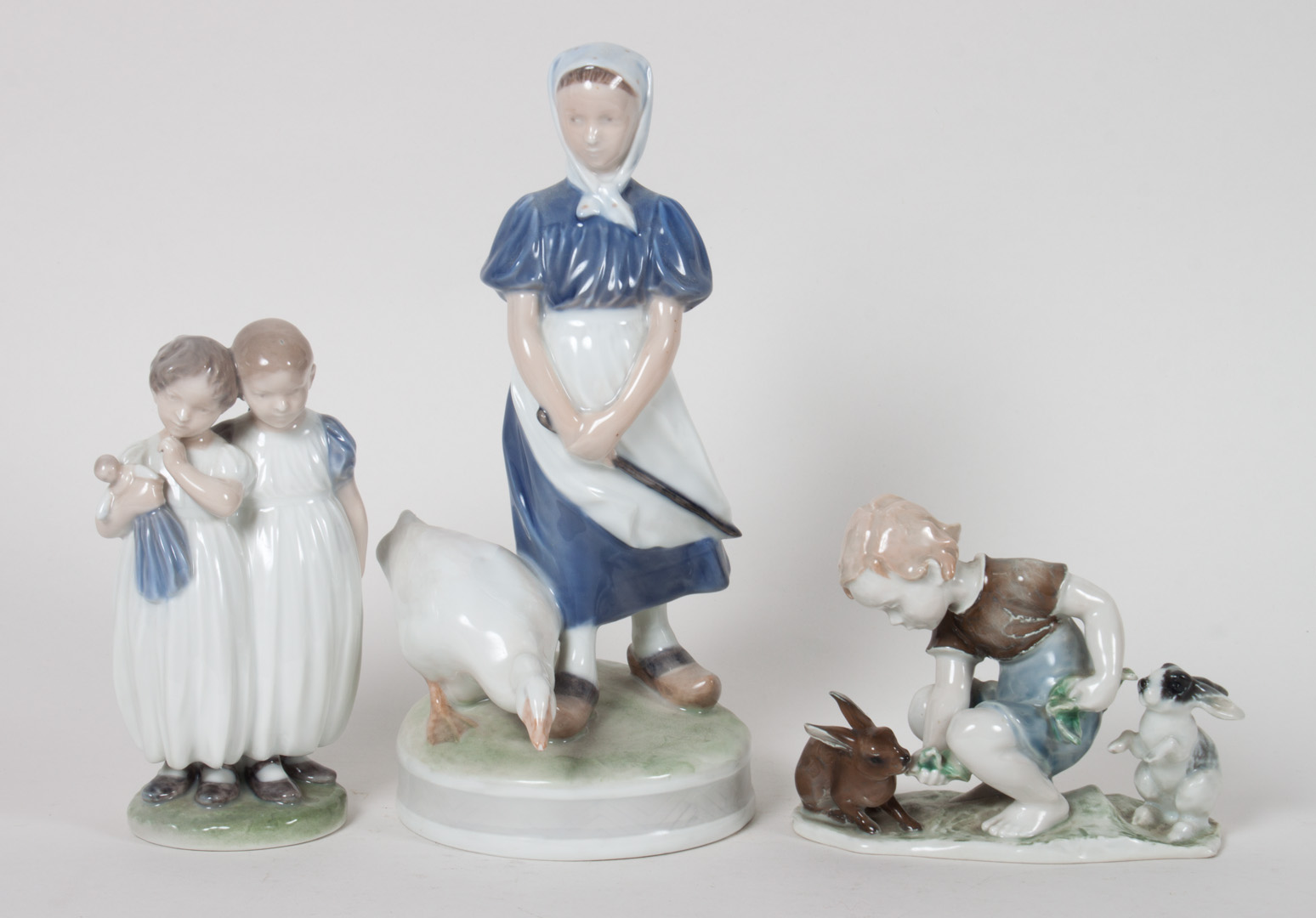 Appraisal: Three Royal Copenhagen Rosenthal figural groups two Royal Copenhagen porcelain