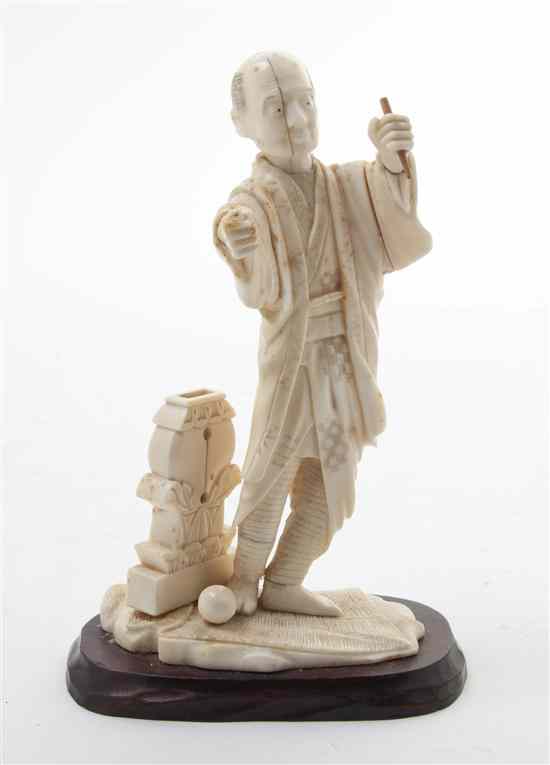 Appraisal: A Japanese Carved Ivory Okimono depicting a standing man set