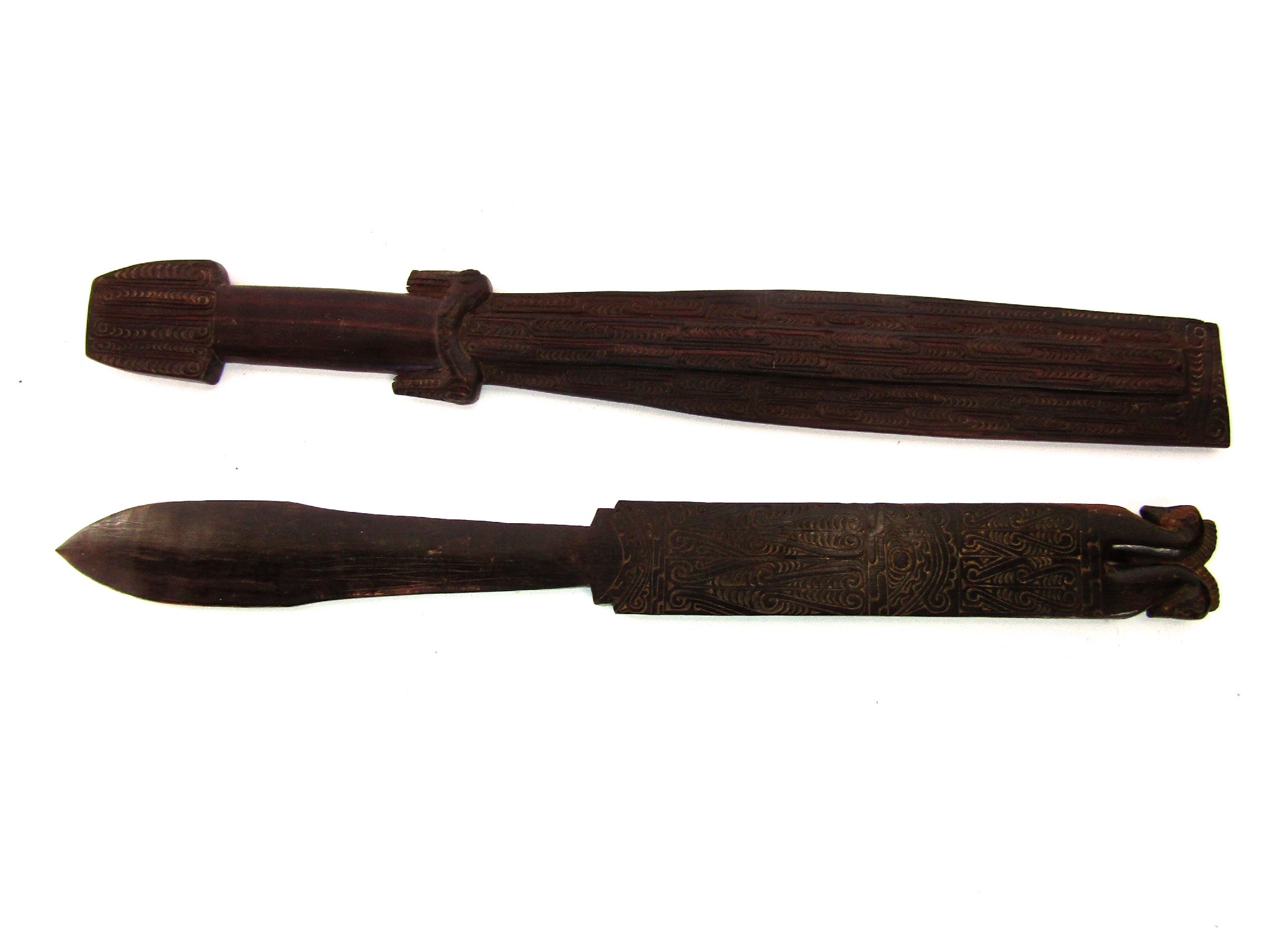 Appraisal: Tribal interest two ceremonial timber clubs each with well detailed