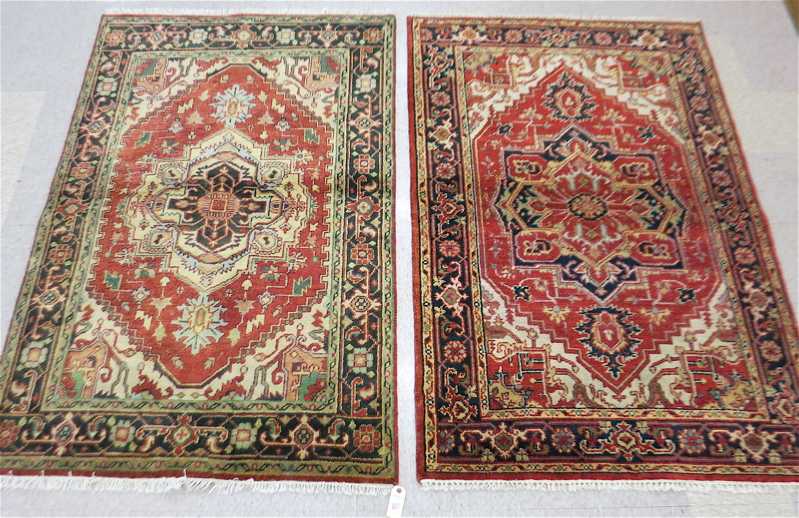 Appraisal: TWO SIMILAR HAND KNOTTED ORIENTAL AREA RUGS Persian Serapi design