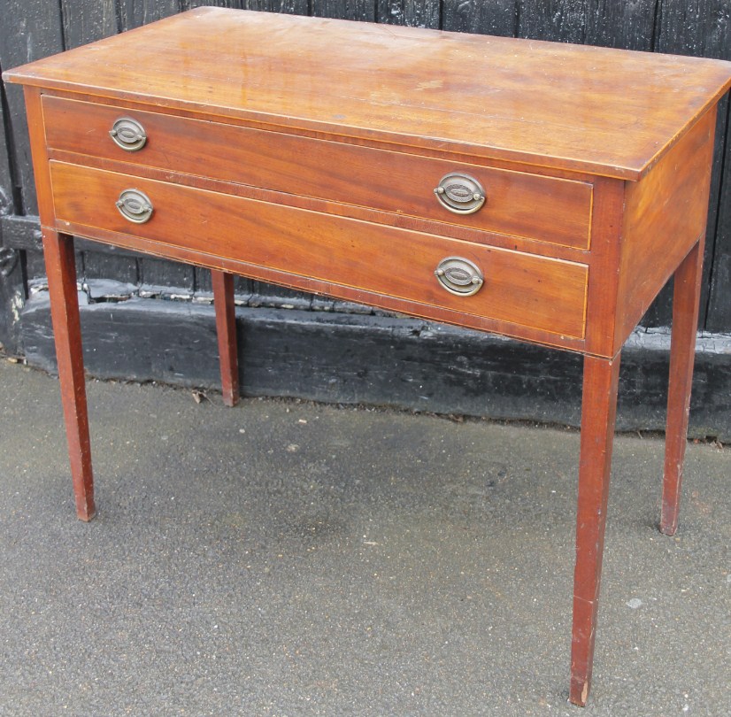 Appraisal: A thC mahogany side table the overhanging top raised above