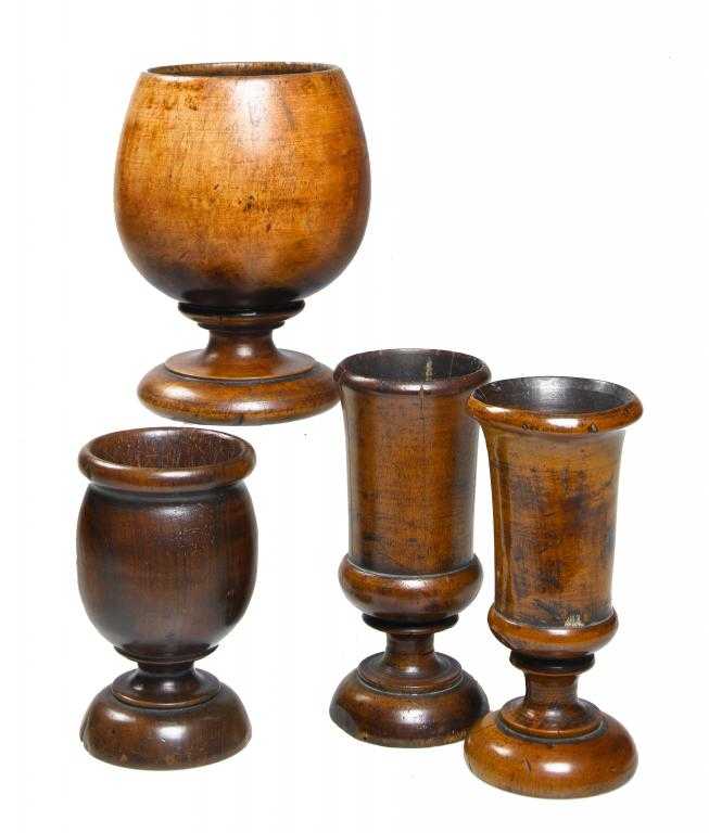 Appraisal: TWO SIMILAR TREEN SLENDER TURNED GOBLETS AN OVOID GOLBET AND