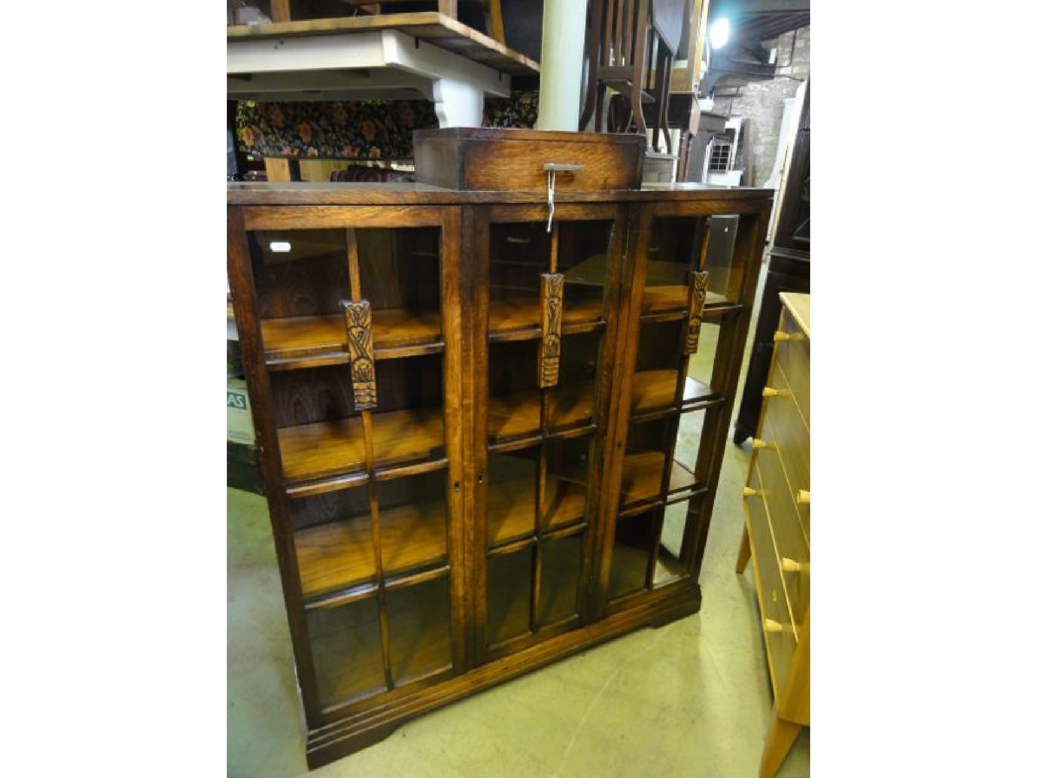 Appraisal: A s oak side cabinet of stepped form enclosed by