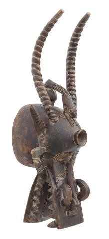 Appraisal: Large African carved wood firespitter helmet mask Senufo people Ivory