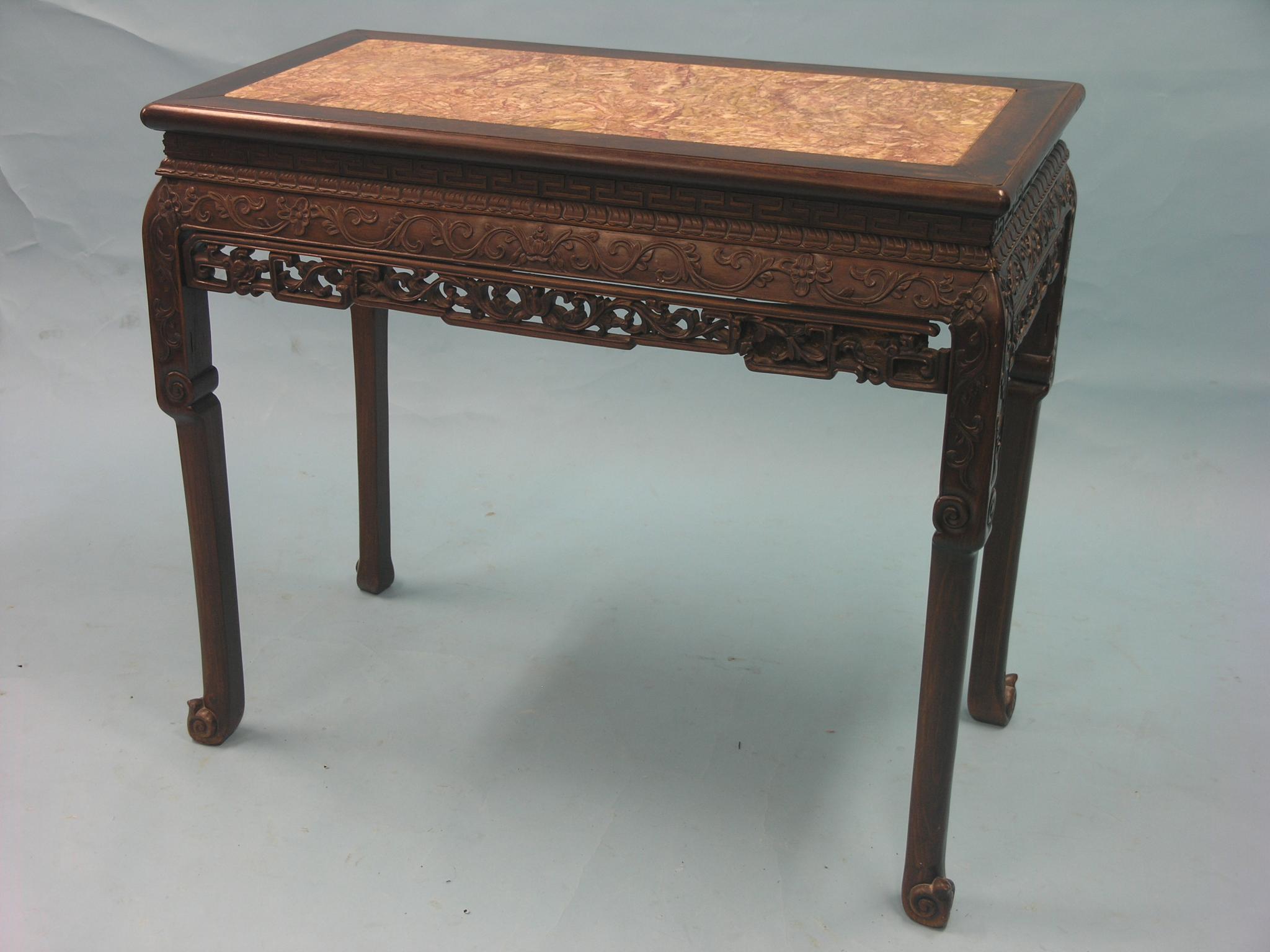 Appraisal: A th century Chinese rosewood side table pink variegated marble