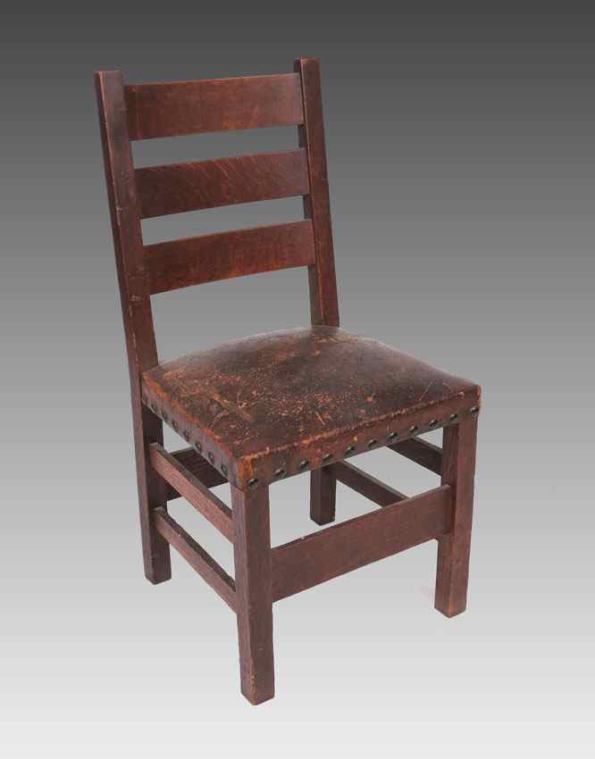 Appraisal: GUSTAV STICKLEY OAK DINING CHAIR Craftsman fumed oak Craftsman leather