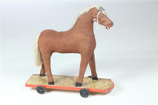 Appraisal: HORSE PULL TOY American nd half- th century Carved horse