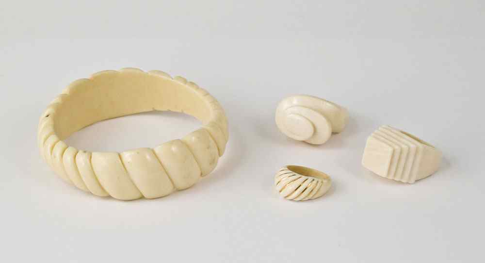 Appraisal: PIECE IVORY BANGLE AND RINGS To include Carved ivory bangle