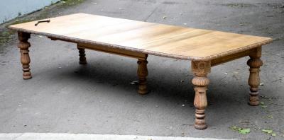 Appraisal: A bleached oak extending dining table with moulded border raised