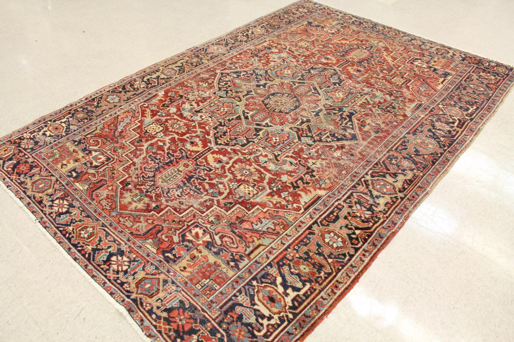 Appraisal: SEMI-ANTIQUE PERSIAN HERIZ CARPET East Azerbaijan Province northwestern Iran geometric