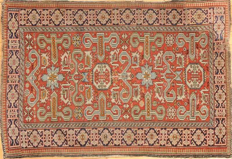 Appraisal: KUBA BRICK-GROUND RUG Worked with octagons and medallions within cobalt