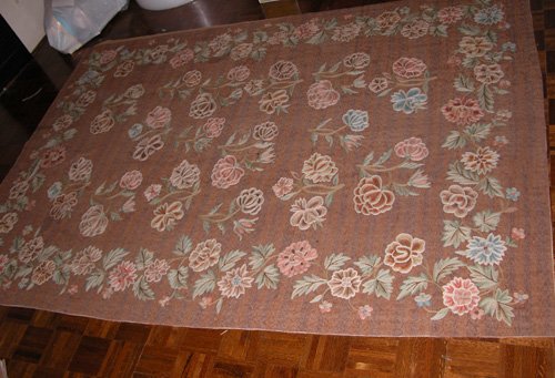 Appraisal: Artist Title Brown Woven Rug with Rose Reserves field interspersed