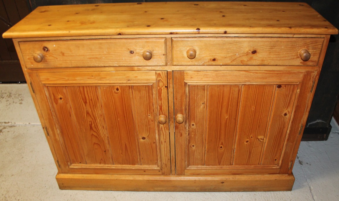 Appraisal: A thC stripped and lightly polished pine side cabinet of