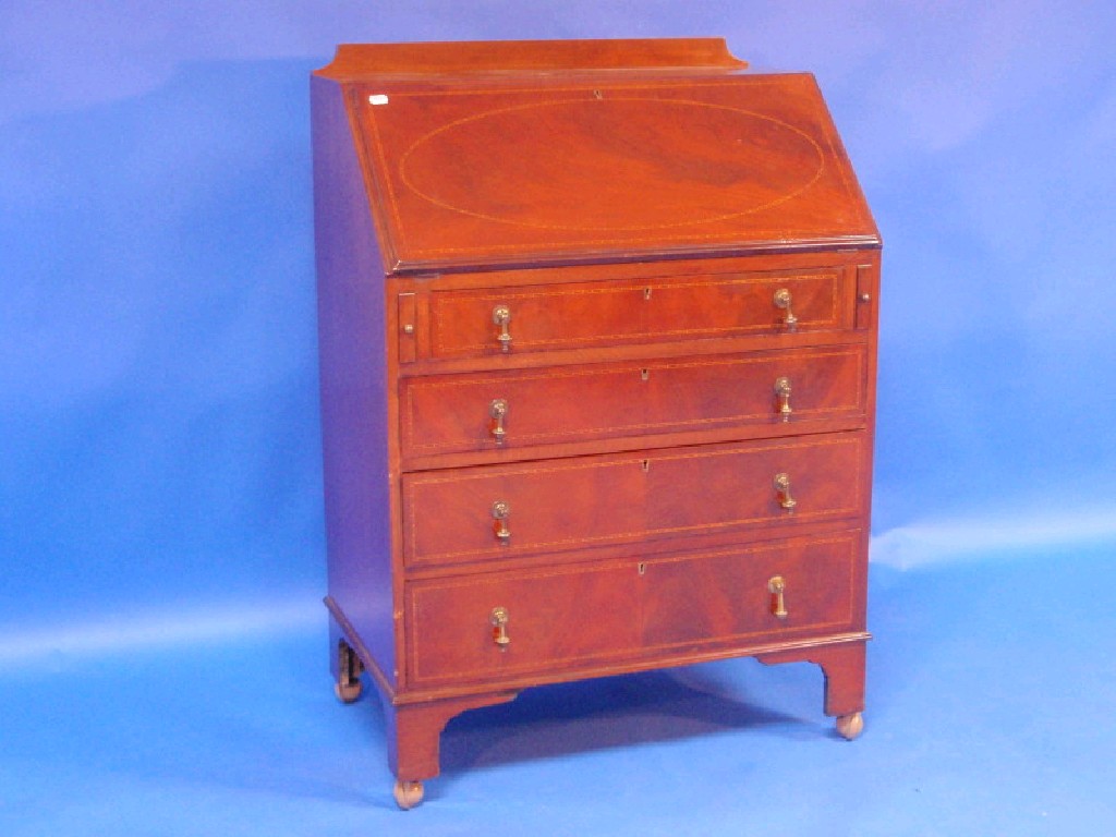 Appraisal: An inlaid mahogany bureau