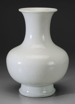 Appraisal: White-Glazed Porcelain Vase Chinese th century baluster form molded decoration