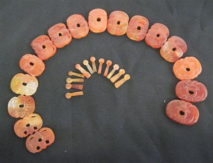 Appraisal: Chinese carved carnelian interlocking beltComprising pierced oval fu bat links