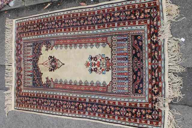 Appraisal: AN IVORY GRAND PRAYER RUG with blue multiple border x