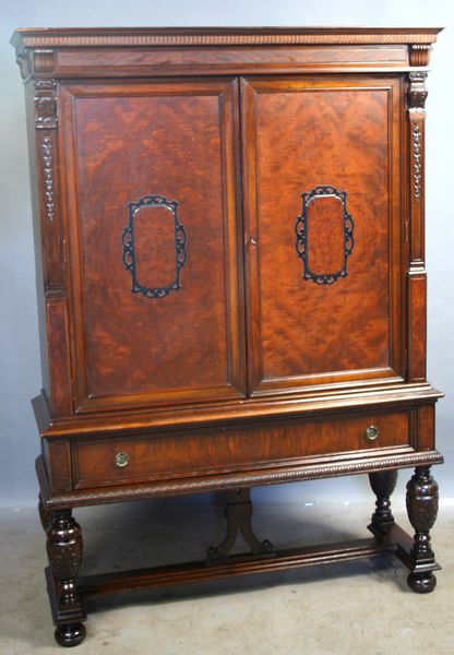 Appraisal: Circa s American burled walnut handcarved blind door cabinet h