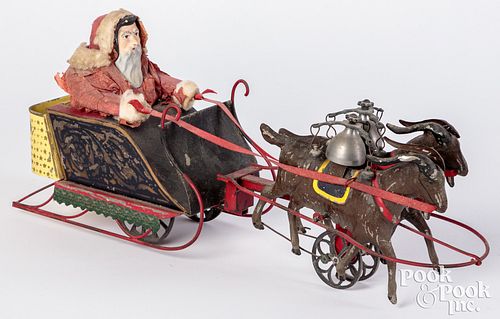 Appraisal: ALTHOF BERGMANN PAINTED TIN SANTA IN GOAT SLEIGHAlthof Bergmann painted