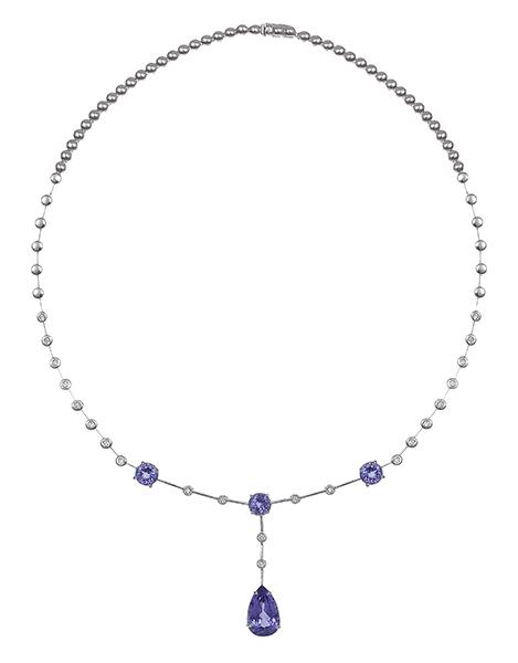 Appraisal: A TANZANITE AND DIAMOND NECKLACE Centrally set with a pear