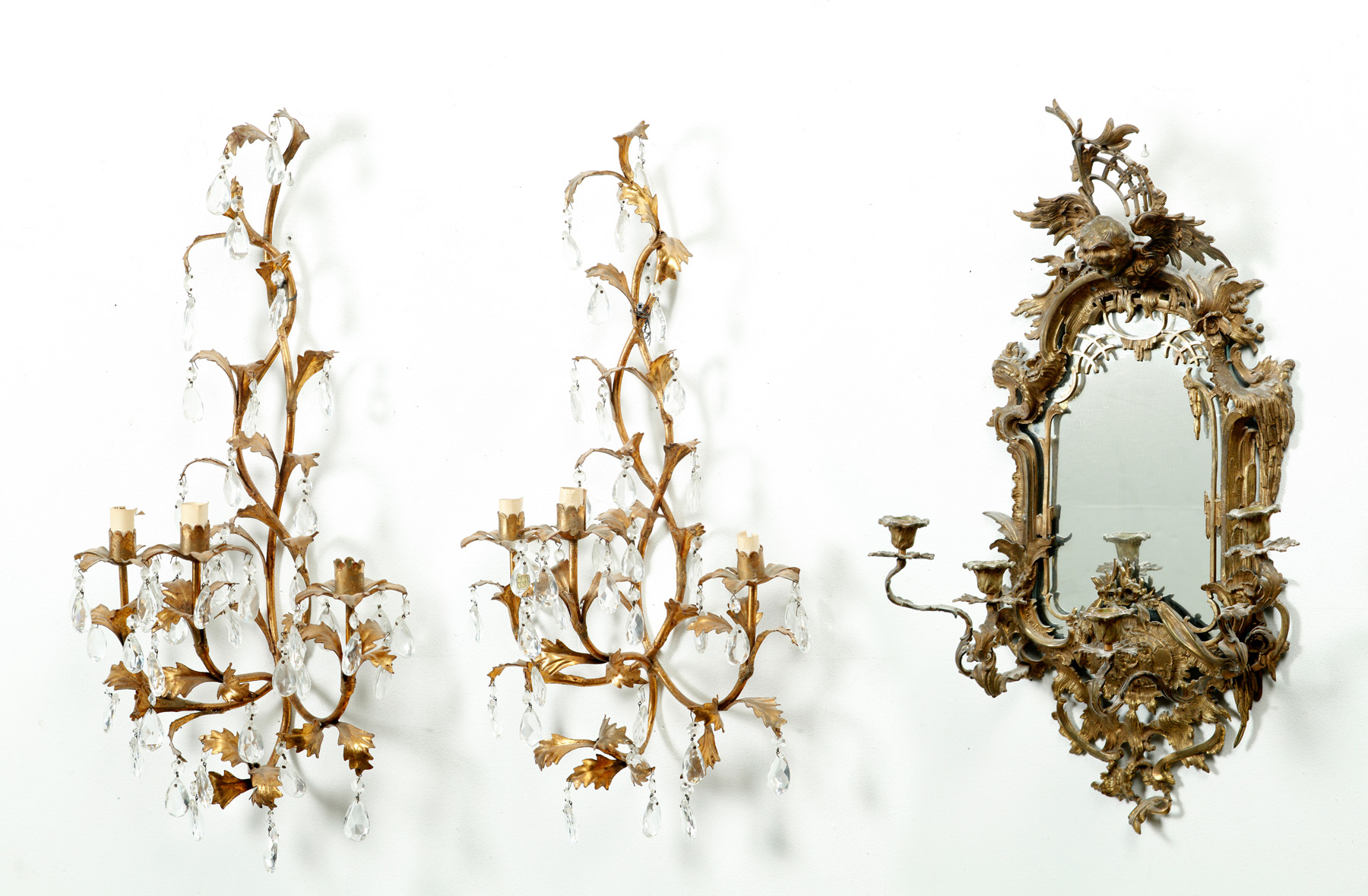 Appraisal: PAIR OF EUROPEAN BRASS WALL SCONCES AND A MIRROR Twentieth