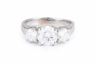 Appraisal: A Three Stone Diamond Engagement Ring Set with a central