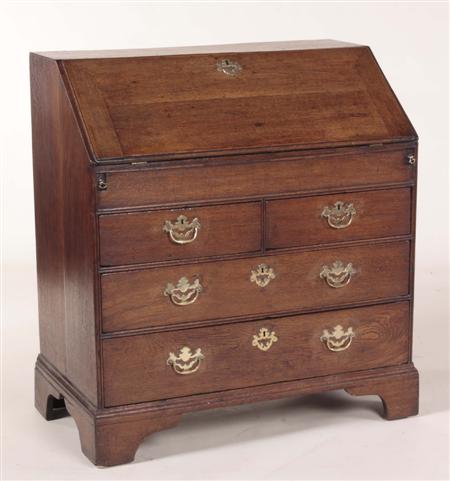 Appraisal: A George I oak bureau the moulded fall-flap enclosing well