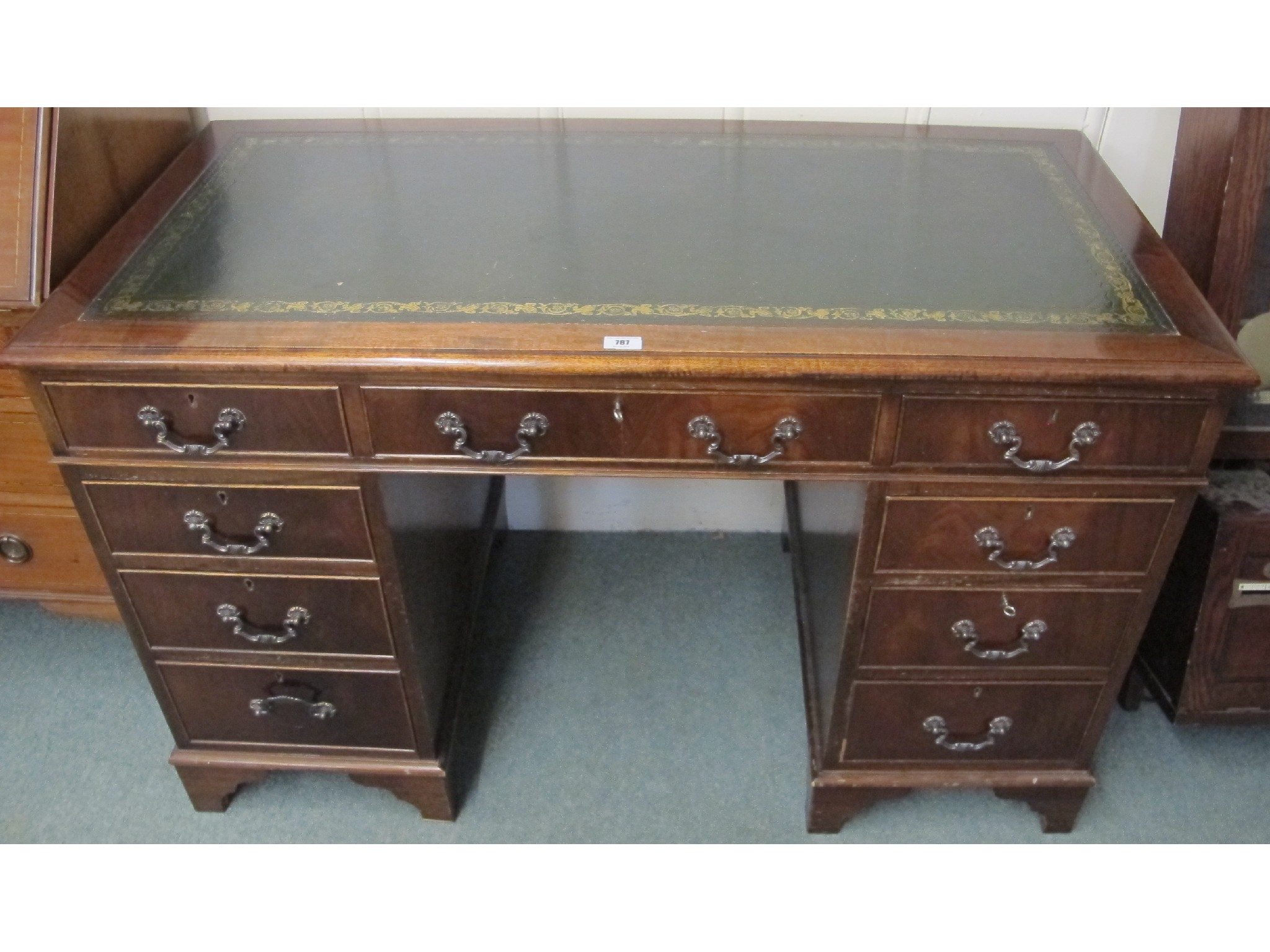 Appraisal: A green leather topped reproduction twin pedestal desk