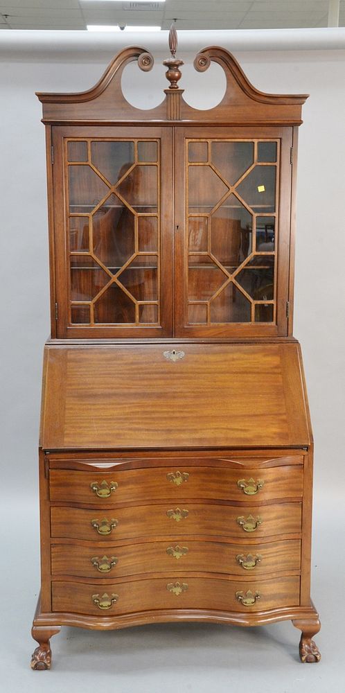 Appraisal: Mahogany secretary desk having serpentine front and ball and claw