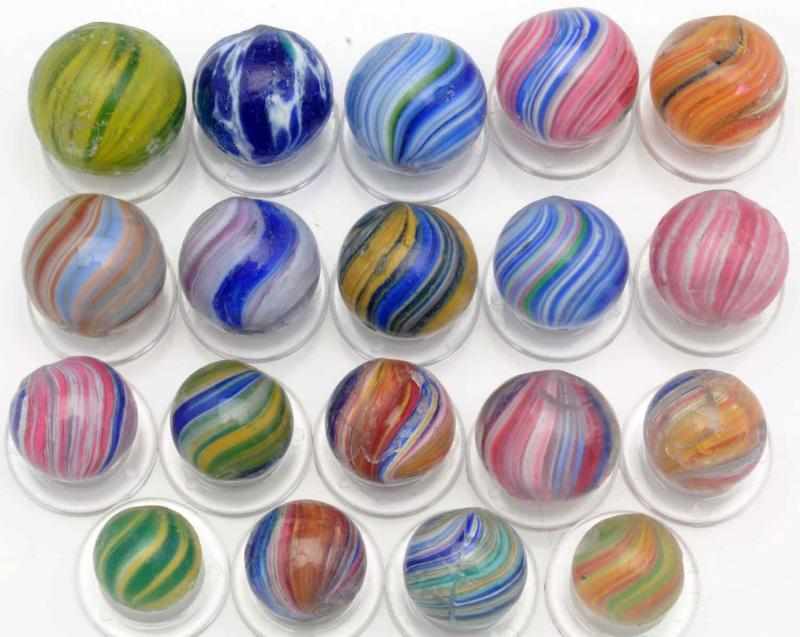 Appraisal: Lot of Onionskin Style Marbles Includes multicolored onionskins one uncased