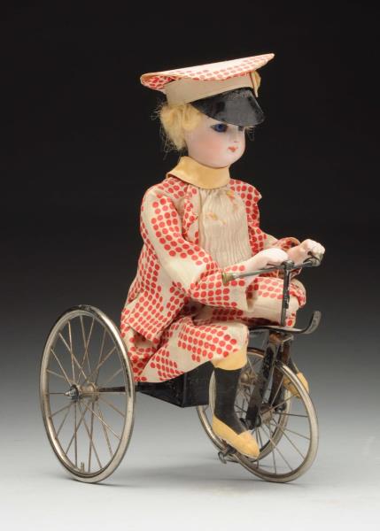 Appraisal: French Mechanical Tricycle Toy Fran ois Gaultier bisque fashion head