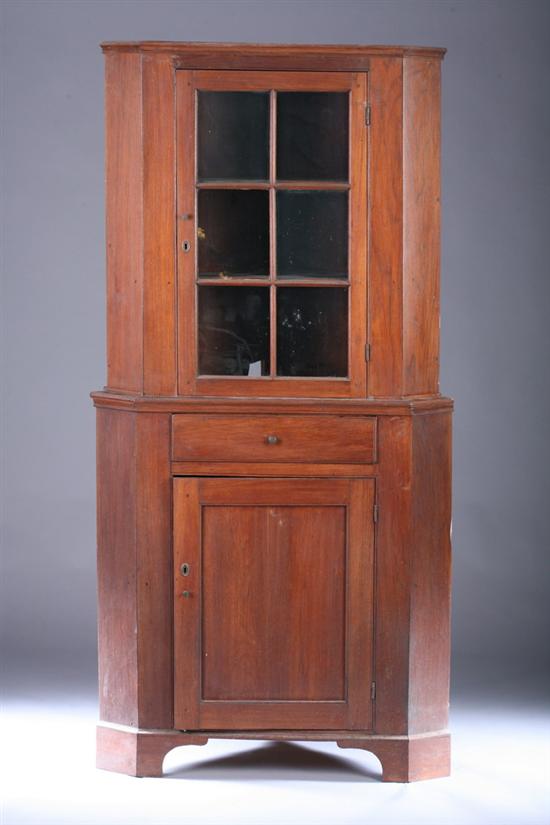 Appraisal: AMERICAN LATE FEDERAL STYLE WALNUT CORNER CABINET Early th century