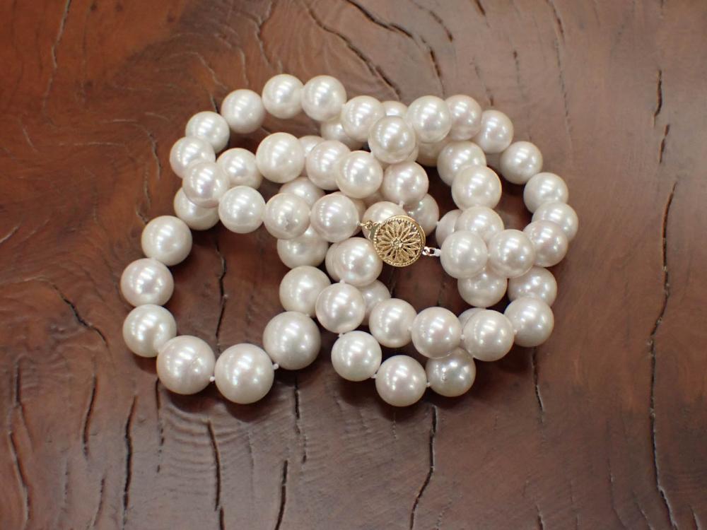 Appraisal: OPERA LENGTH PEARL AND EIGHTEEN KARAT GOLD NECKLACE hand-knotted strand