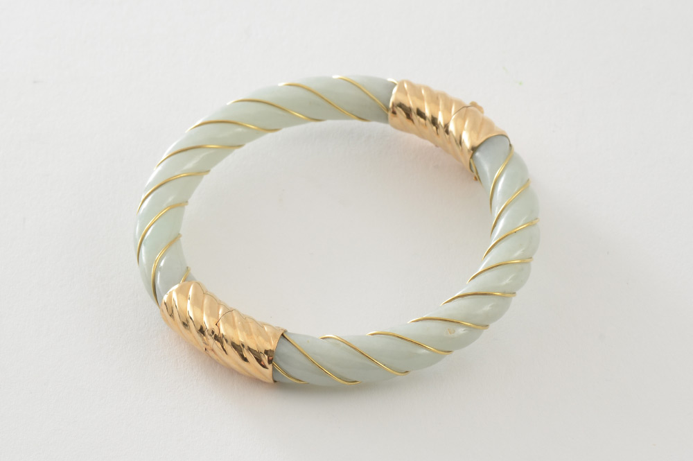 Appraisal: JADE BANGLE BRACELET K yellow gold and twist carved jadeite