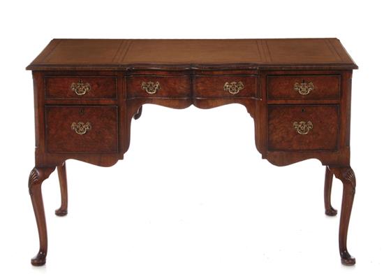 Appraisal: Queen Anne style writing desk crossbanded leather-inset top over drawers