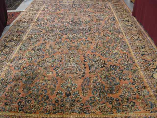 Appraisal: Sarouk Persian Handmade Room Size Rug elaborate designs on salmon