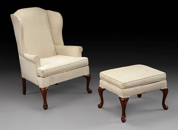 Appraisal: A George III style wing chair and ottoman second quarter