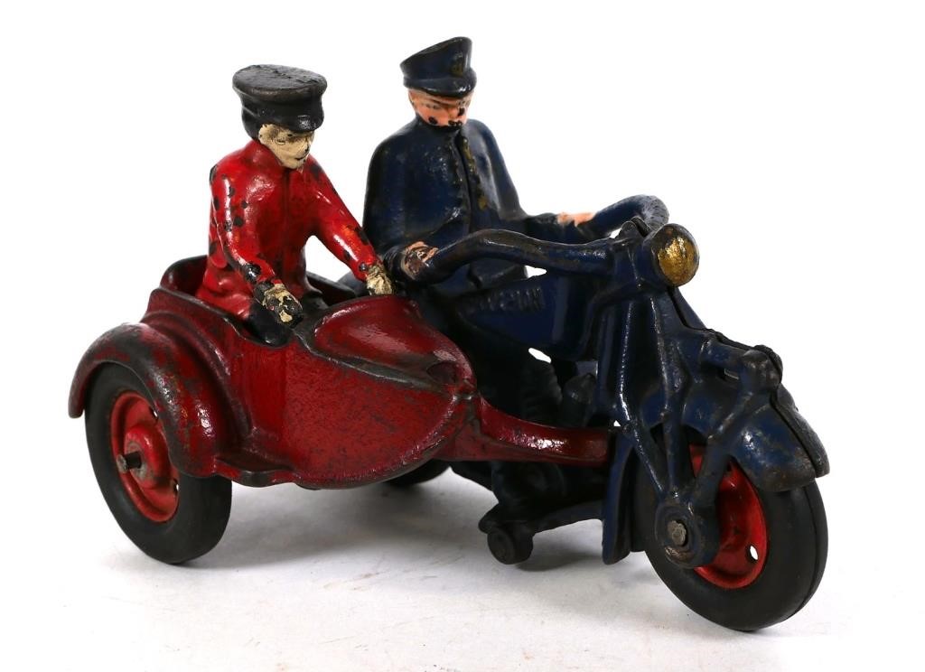 Appraisal: CAST IRON CHAMPION POLICEMAN MOTORCYCLE W SIDECARBlue and Red Cast